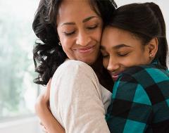 Mom and daughter hugging